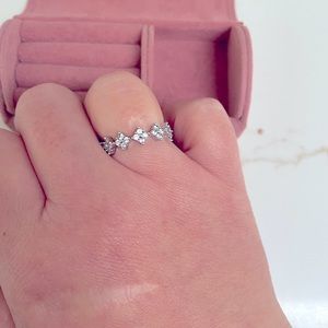 Rhodium plated cz cluster ring.